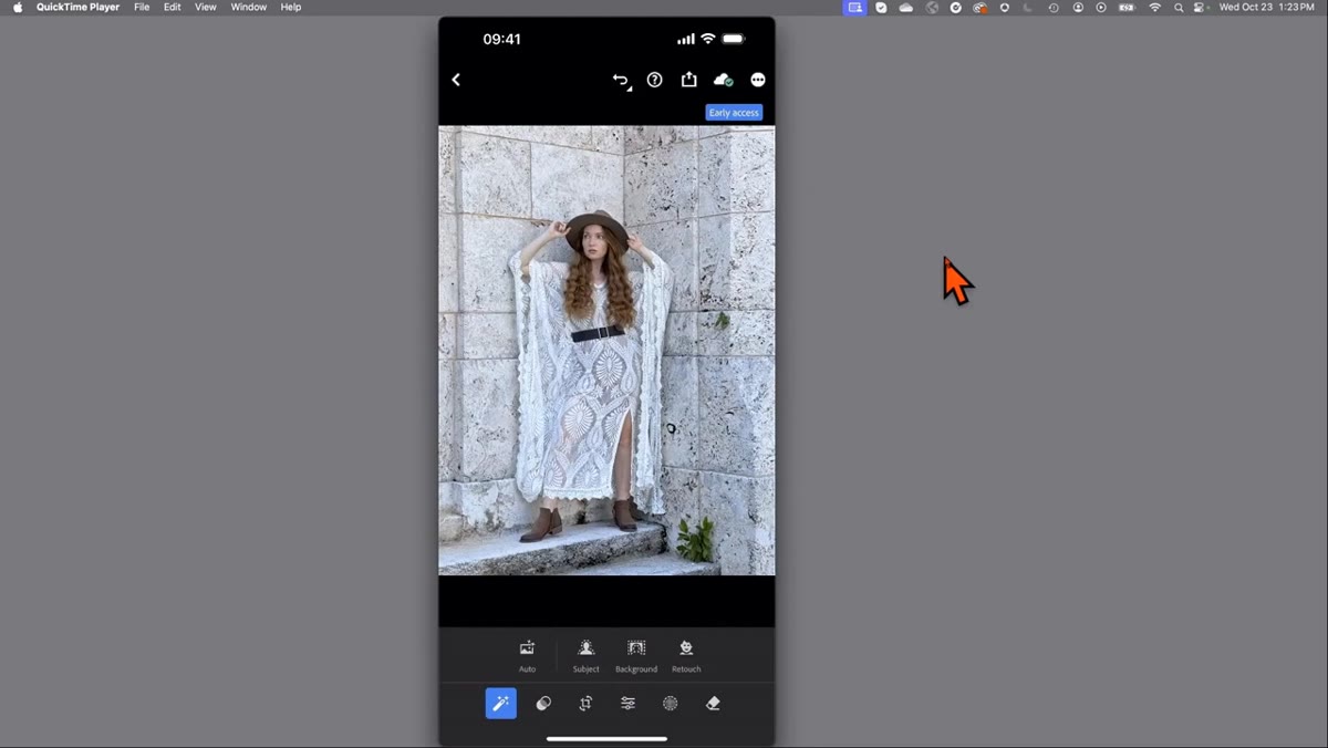 Magic wand icon tapped, subject detected with retouch icon visible