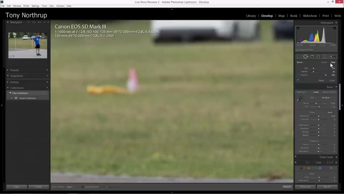 Brushing over a traffic cone on a yellow shirt