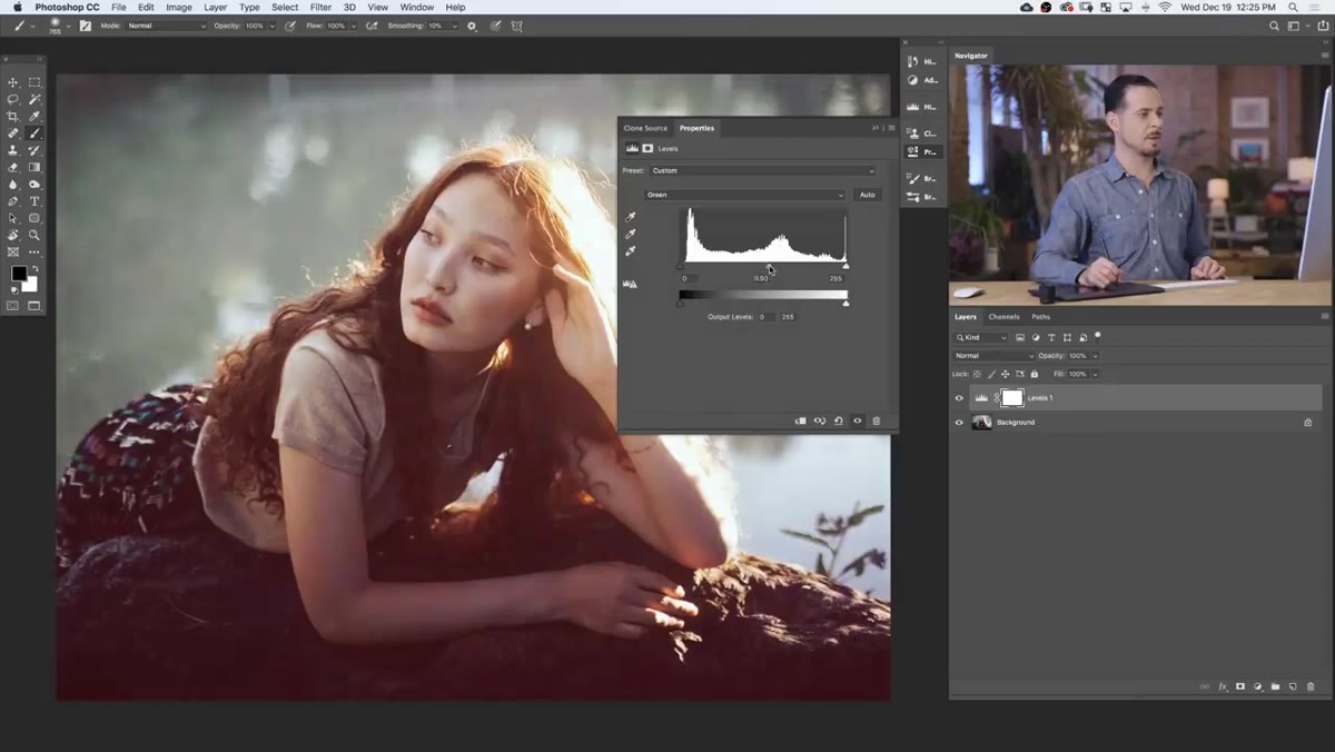 Green channel selected with midtone slider being moved in Levels