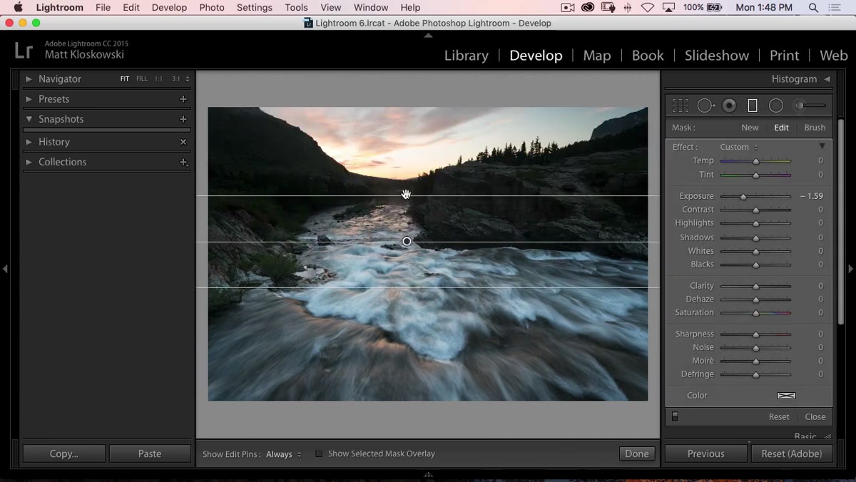 Graduated filter being dragged from top of image over the sky