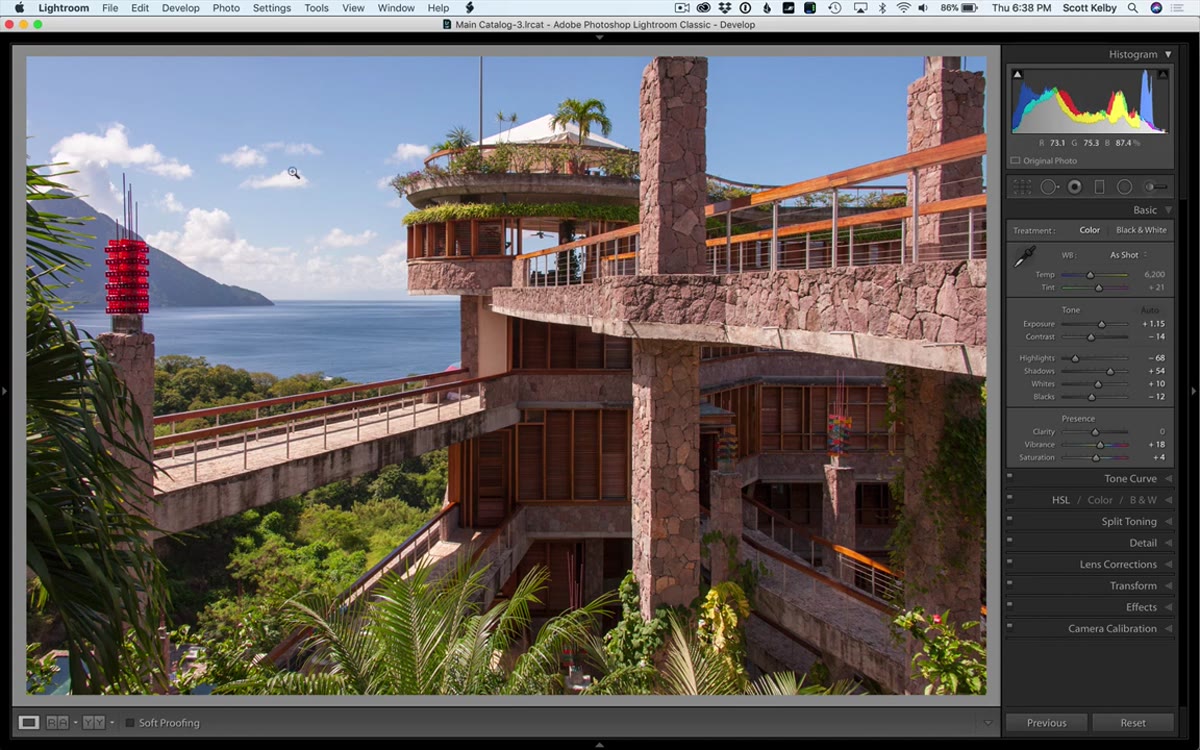 Exposure slider being pulled back to protect highlight detail in sky