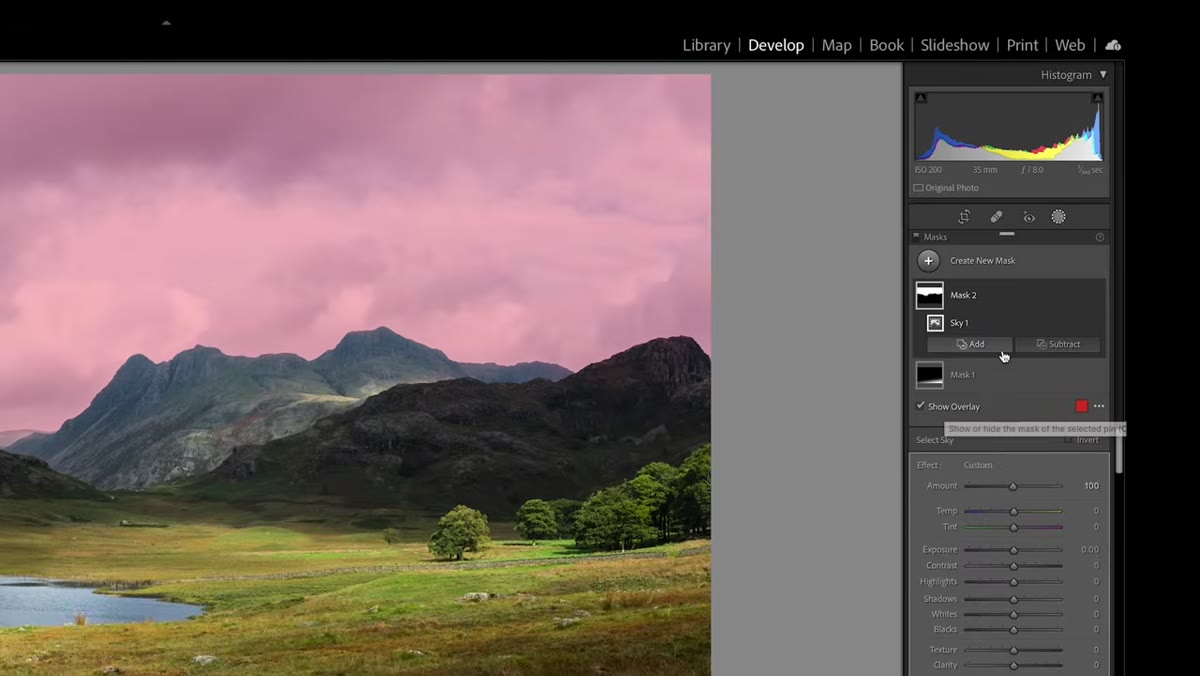 Brush tool selected, painting adjustment onto sky area