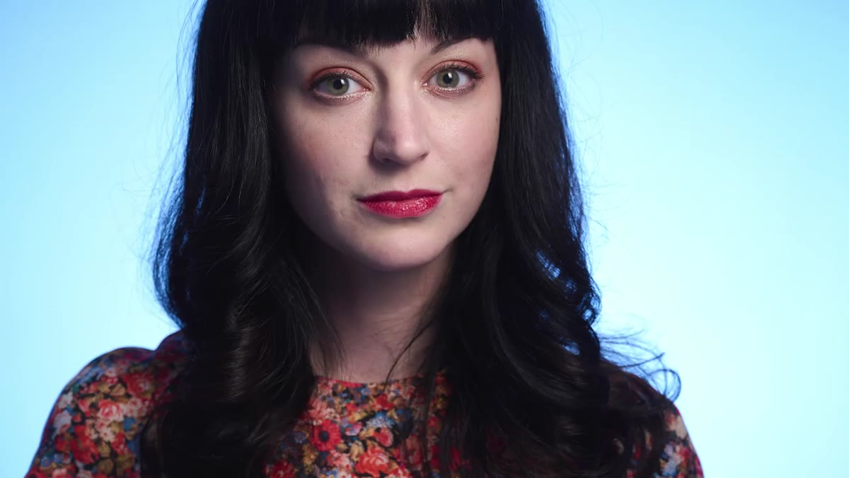 Final portrait showing warm subject against cool blue background