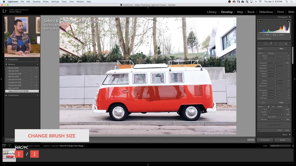 Red mask overlay visible on Volkswagen body while painting