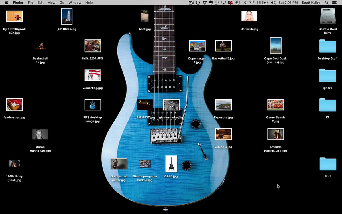 Desktop cluttered with unsorted photo files scattered everywhere